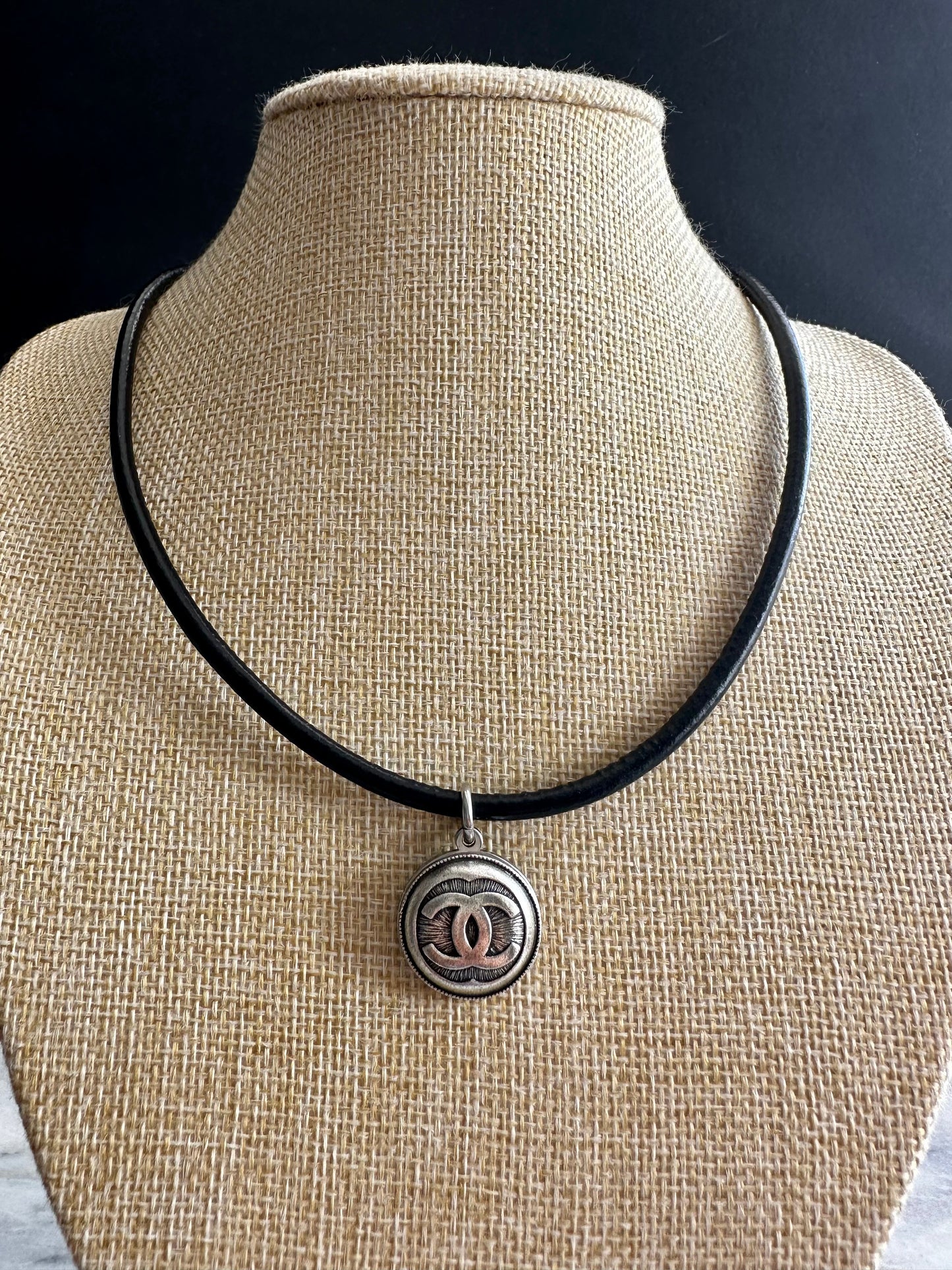 Authentic Reworked silver Button made with a leather necklace