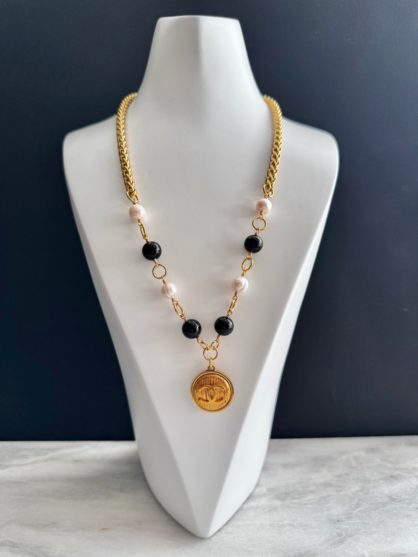 One of a kind black and white pearls and Authentic Reworked button necklace