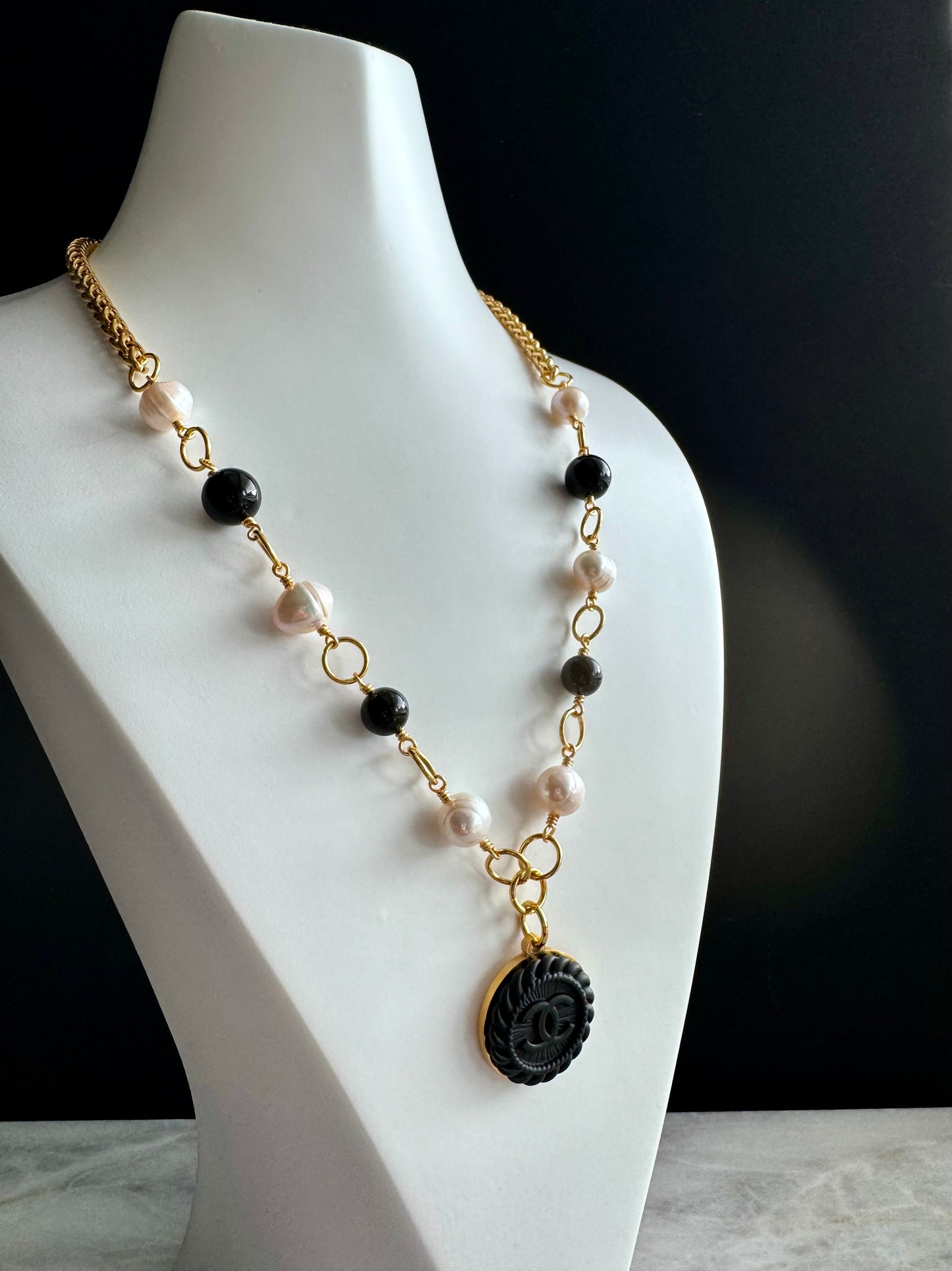 One of a kind black and white pearls and Authentic Reworked button necklace