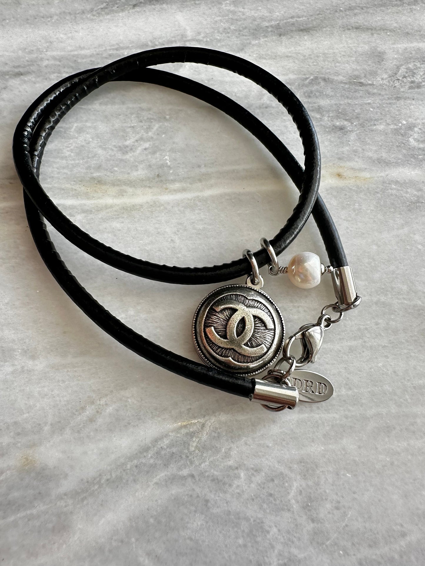 Authentic Reworked silver Button made with a leather necklace